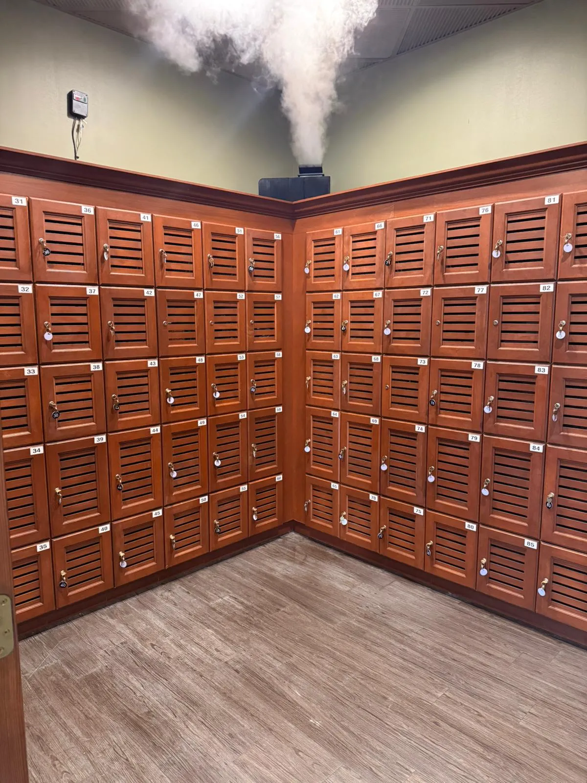 The humidor locker room at Cigar Heaven Webster — numbered, climate-controlled lockers with on-site humidification.