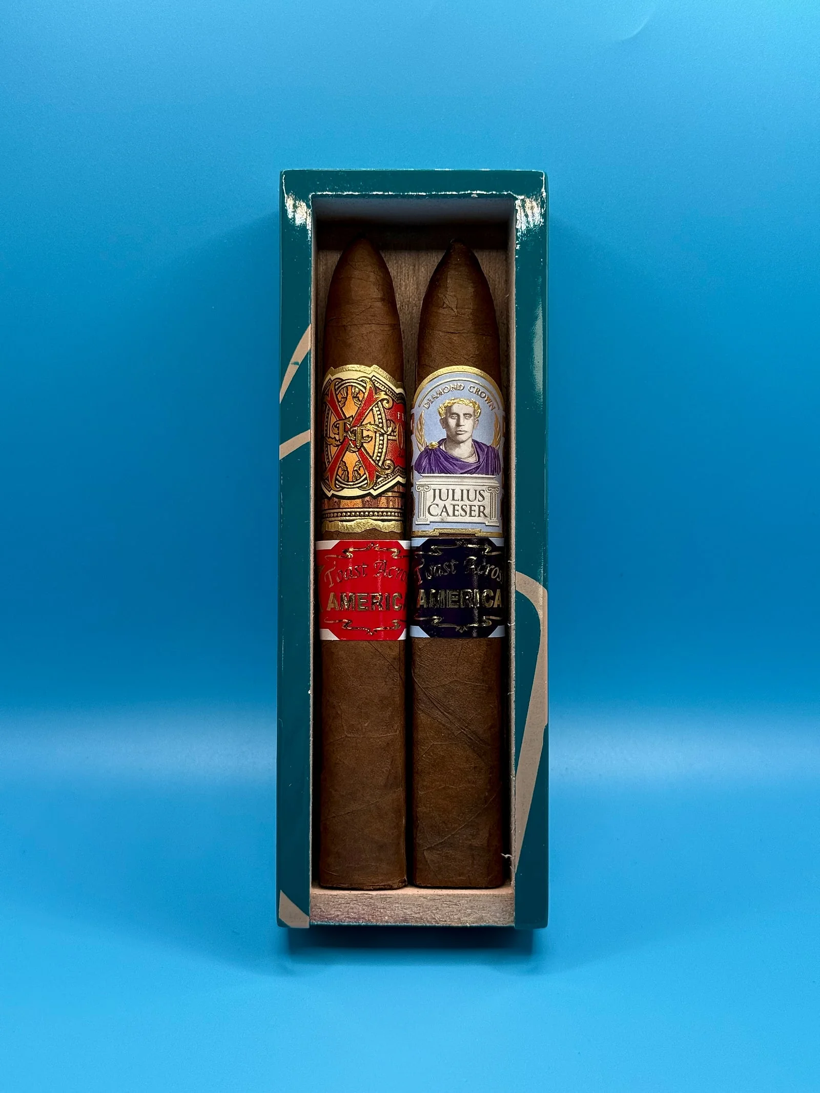 The Toast Across America charity two-pack: a Fuente Fuente OpusX and a Diamond Crown Julius Caeser torpedo side by side.